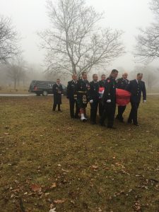 Pall Bearers carrying Donald Brasseur to his final resting place